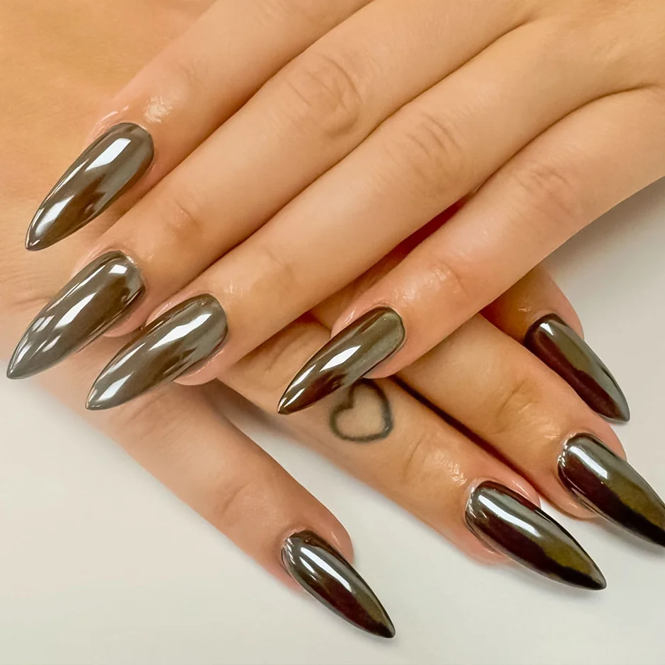 Long stiletto nails in a deep brown chrome finish